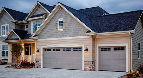 Grey Garage Doors on a authorized home in OKC 